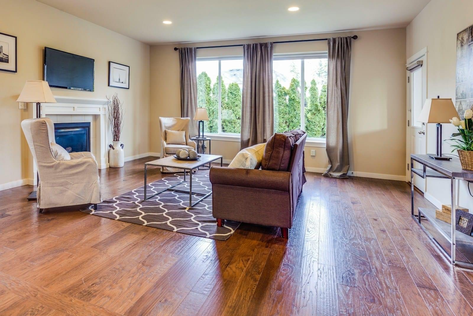 a living room filled with furniture and a fire place
