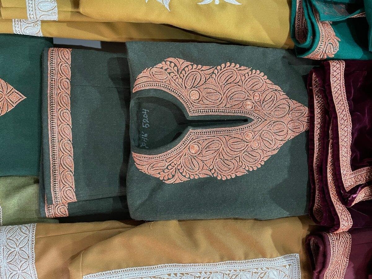 a group of different colored fabrics on display